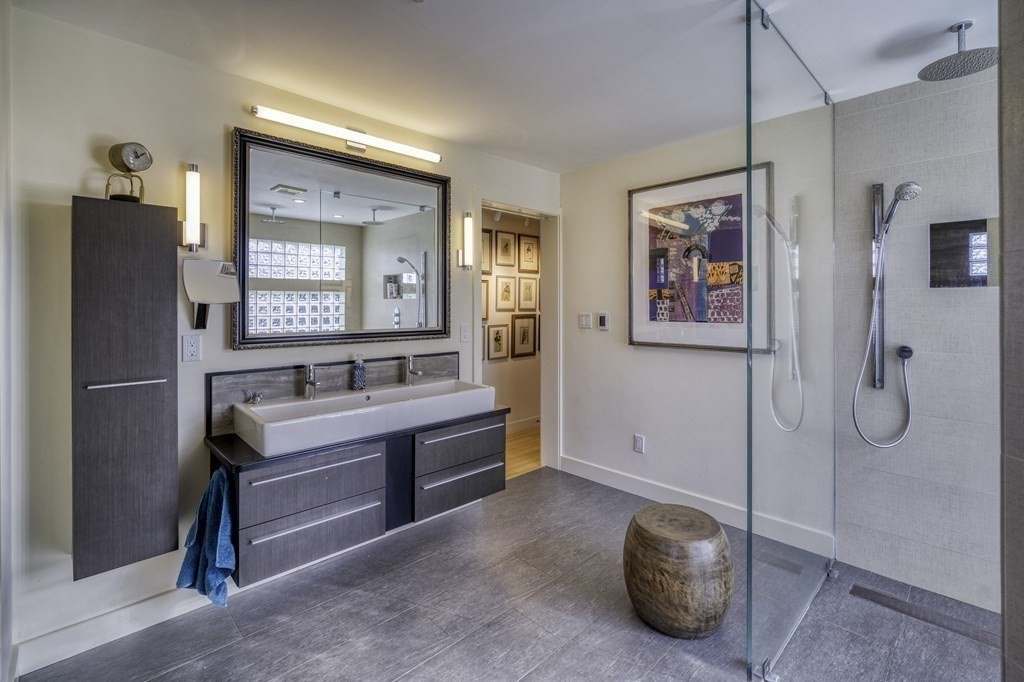 37 Beverly Road Arlington, MA 02474 - Photo 21 of 42 a bathroom with a tub shower and mirror