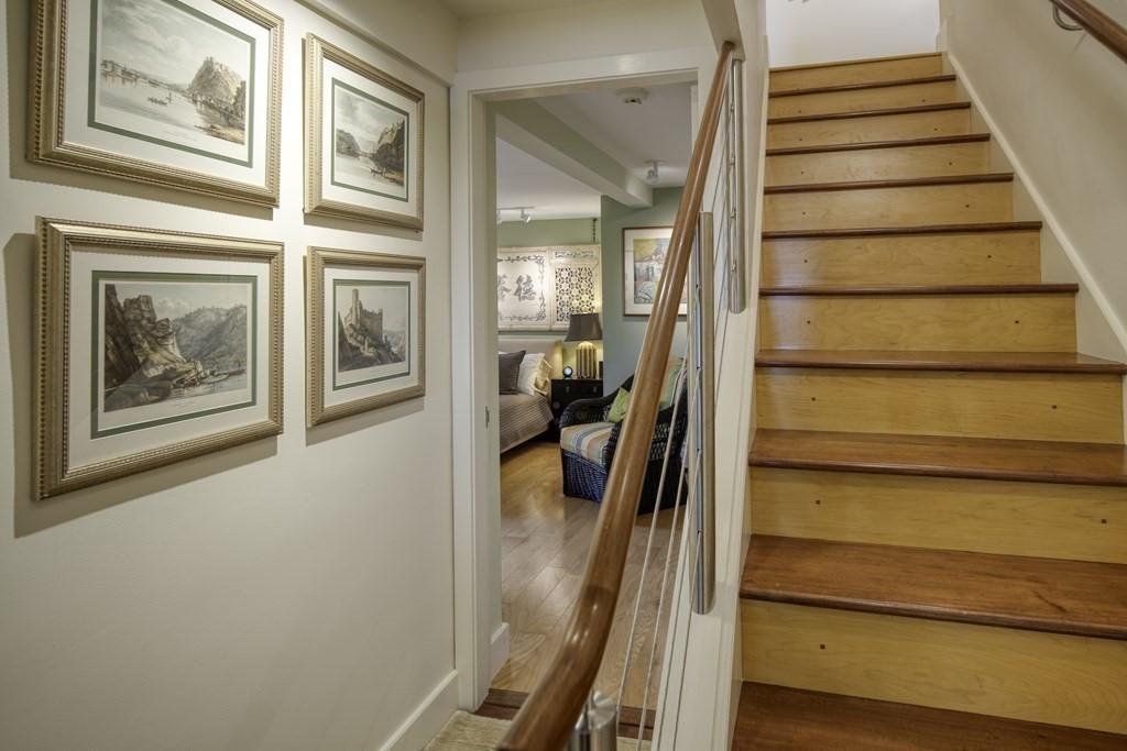 37 Beverly Road Arlington, MA 02474 - Photo 24 of 42 a view of a hallway with wooden floor and staircase