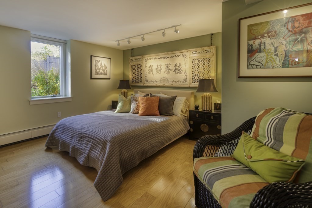 37 Beverly Road Arlington, MA 02474 - Photo 25 of 42 a bedroom with a bed and wooden floor