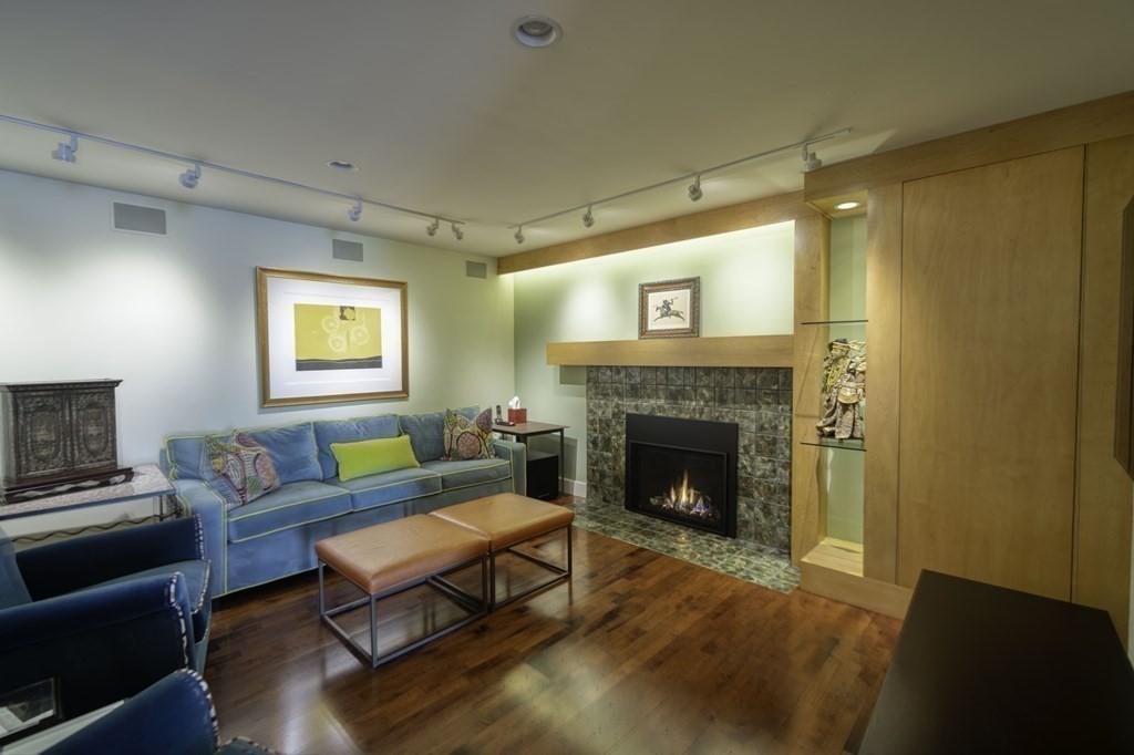 37 Beverly Road Arlington, MA 02474 - Photo 32 of 42 a living room with furniture and a fireplace