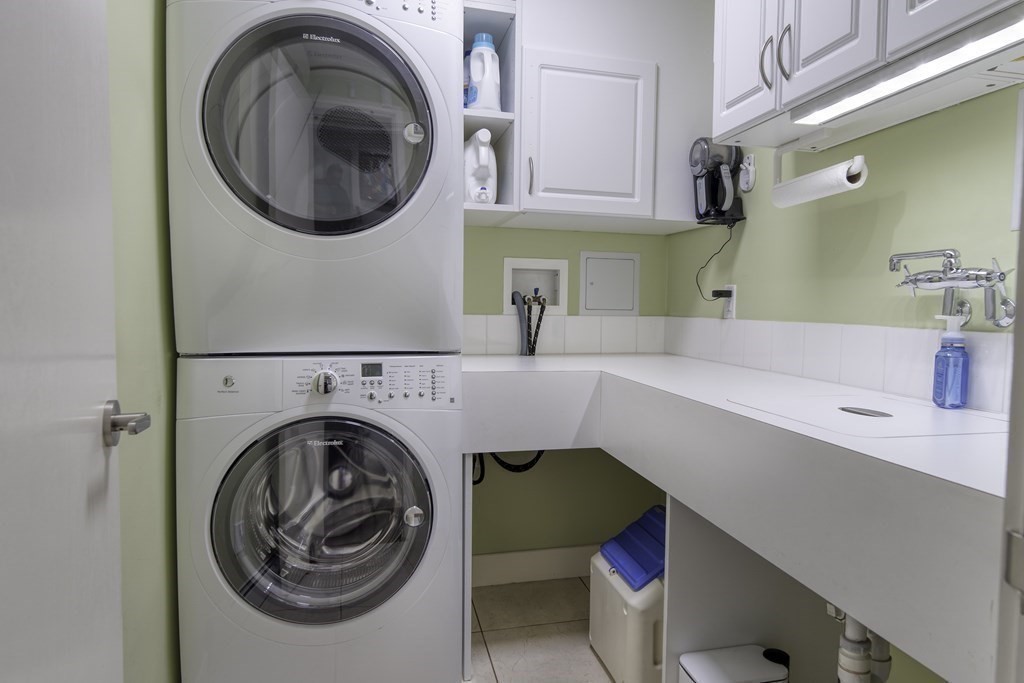 37 Beverly Road Arlington, MA 02474 - Photo 35 of 42 a bathroom with a sink a washer and dryer