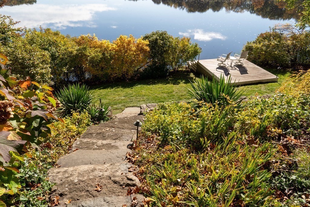 37 Beverly Road Arlington, MA 02474 - Photo 40 of 42 a view of a garden with a building in the background