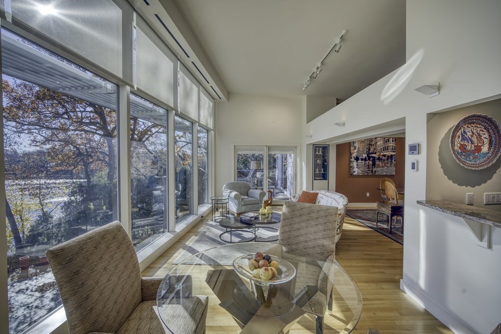 37 Beverly Road Arlington, MA 02474 - Photo 10 of 42 a living room with furniture and a floor to ceiling window