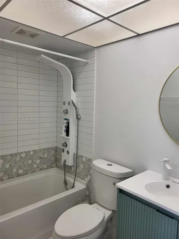 a bathroom with a toilet and a bathtub