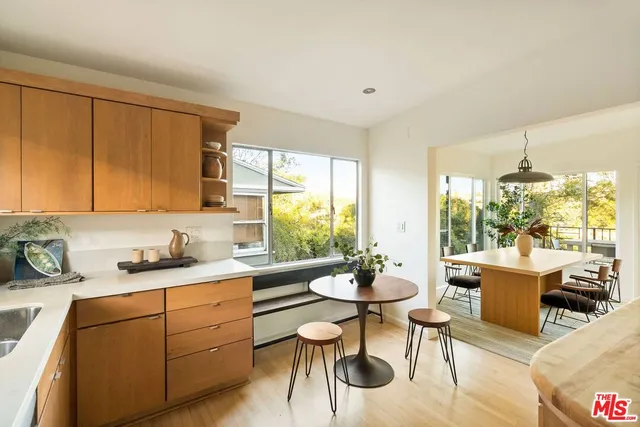 a view of a dining room with furniture window and outside view