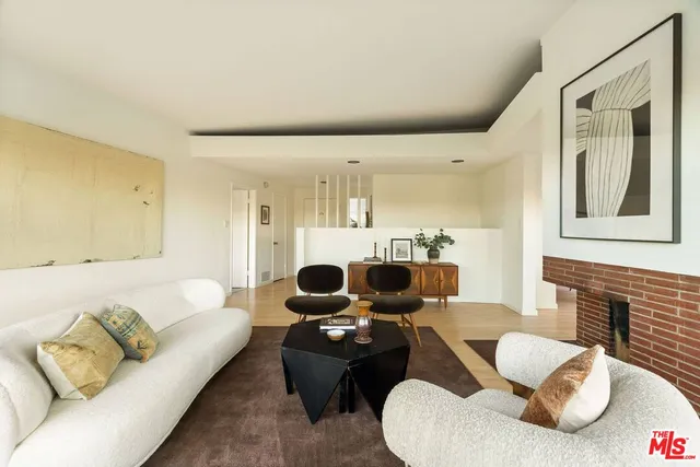 a living room with furniture or couch and a fireplace