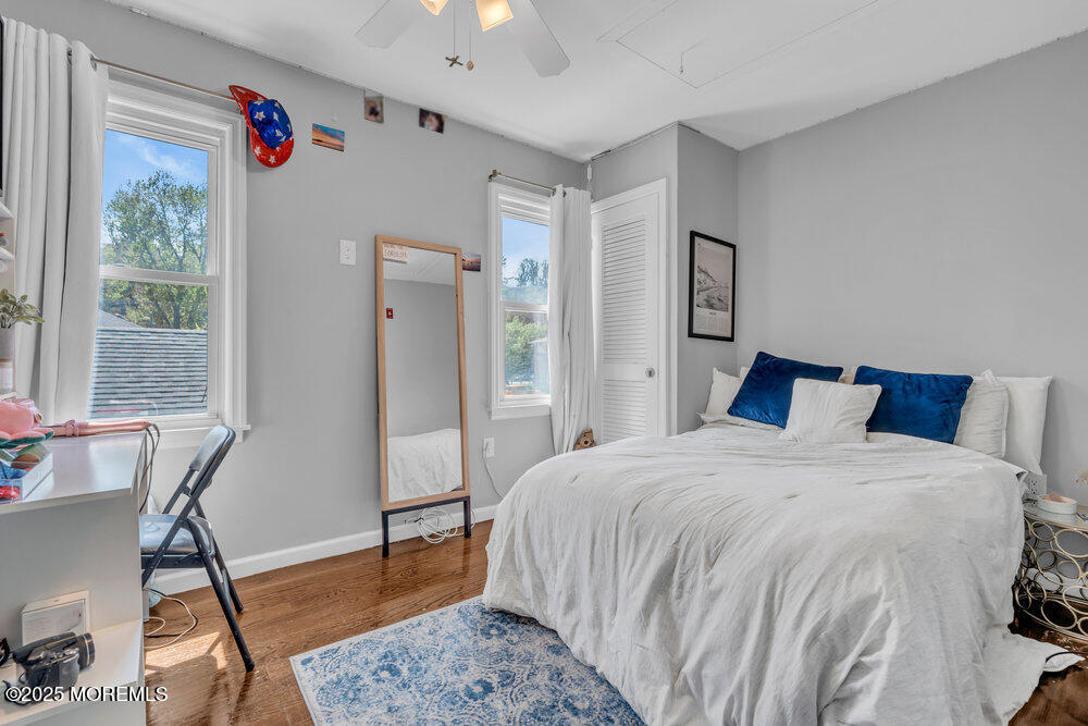 19 Gravelly Point Road Highlands, NJ 07732 - Photo 15 of 35 a bedroom with a bed and a table in it