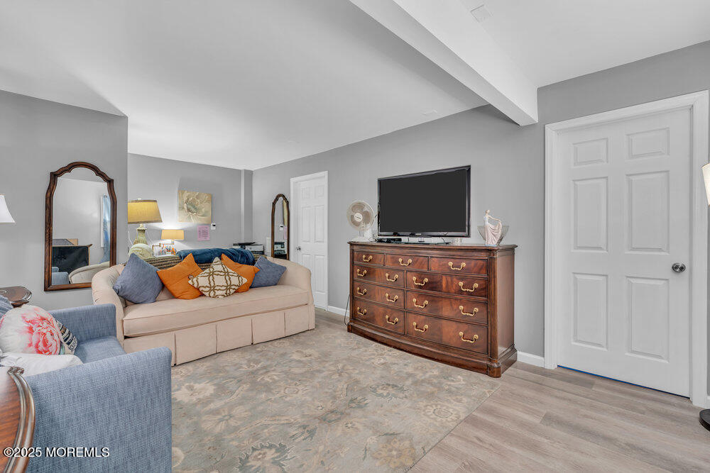 19 Gravelly Point Road Highlands, NJ 07732 - Photo 18 of 35 a living room with furniture and a flat screen tv