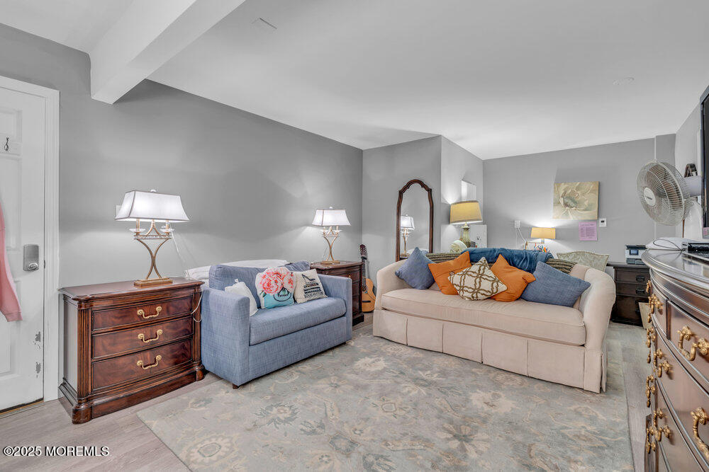 19 Gravelly Point Road Highlands, NJ 07732 - Photo 19 of 35 a living room with furniture and a lamp