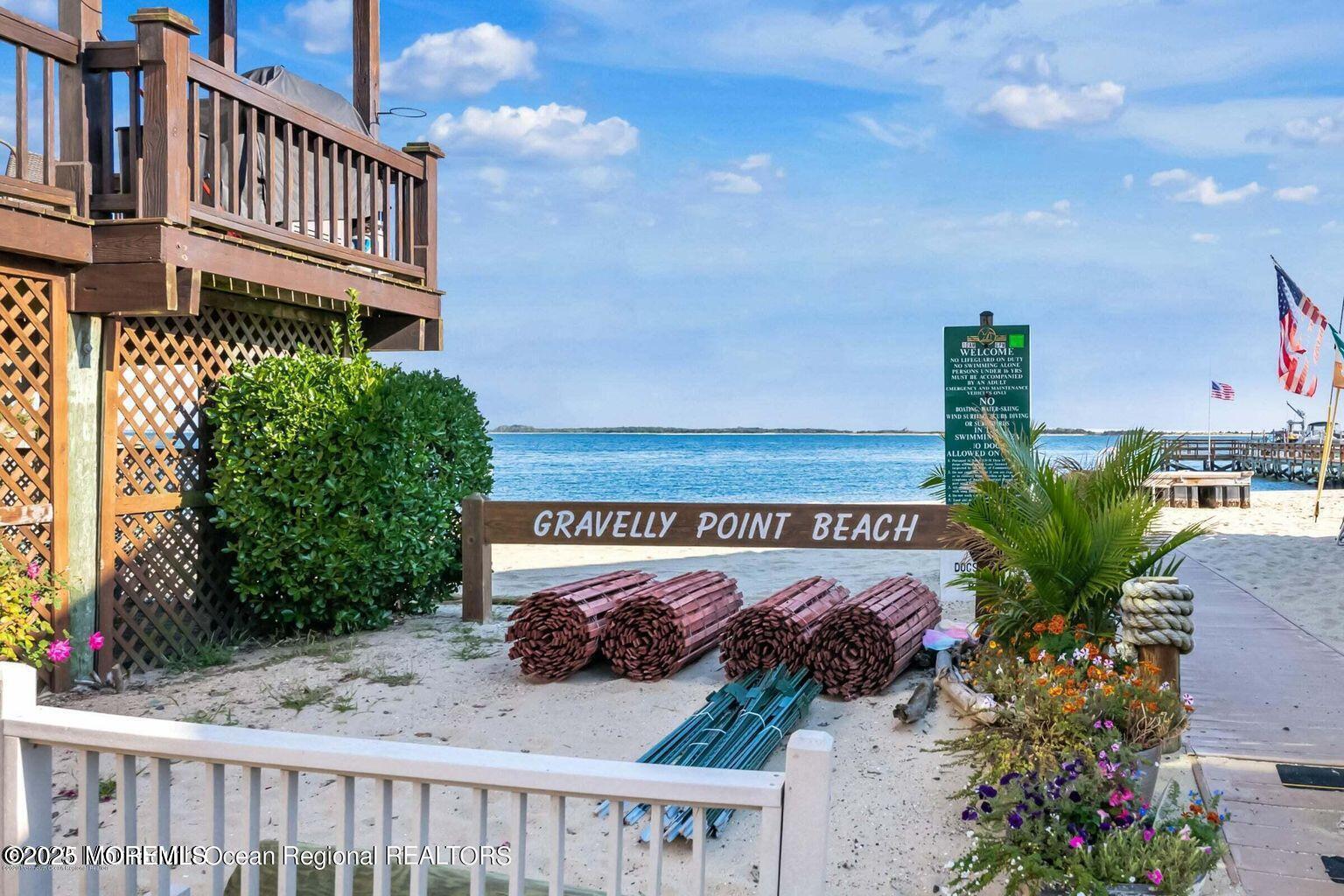 19 Gravelly Point Road Highlands, NJ 07732 - Photo 28 of 35 a view of a street with flower garden and wooden fence