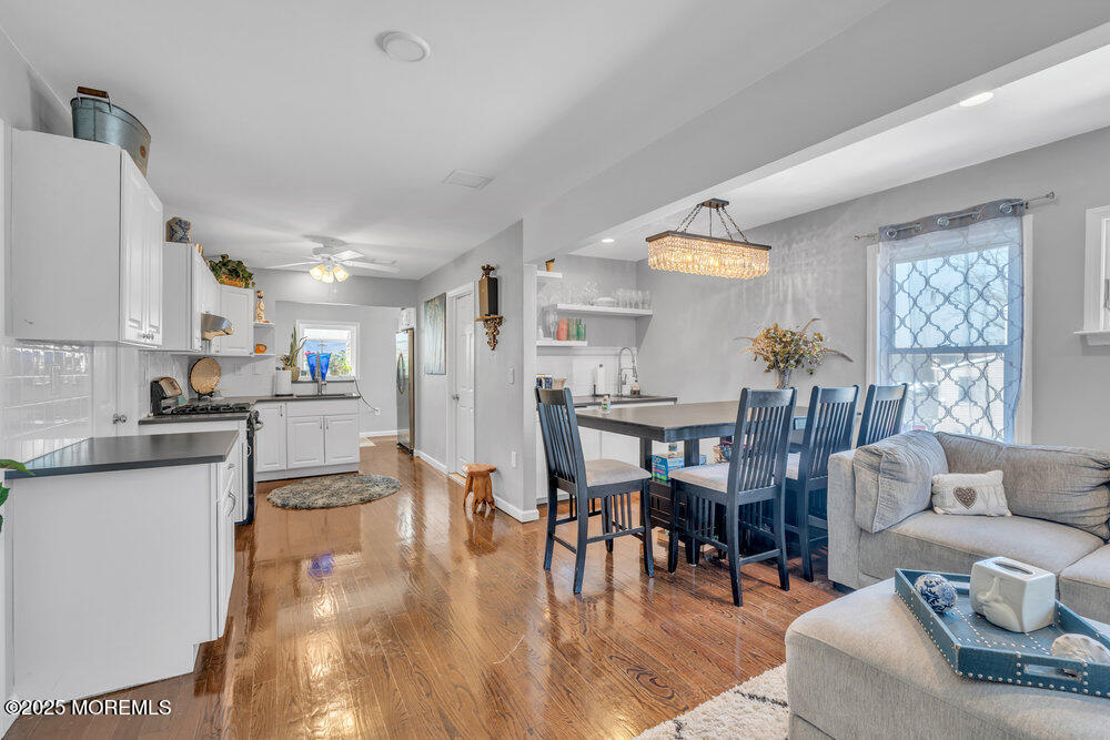 19 Gravelly Point Road Highlands, NJ 07732 - Photo 7 of 35 a living room with furniture and kitchen view