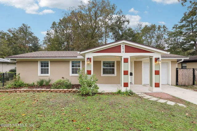 a front view of a house with garden