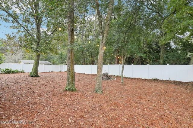 a backyard of a house with lots of green space
