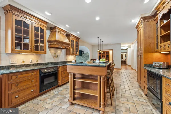 a kitchen with a stove and a sink