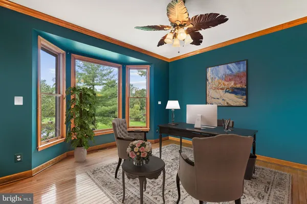 a work room with furniture and a window