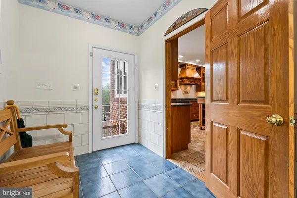 a view of staircase with wooden floor and a window