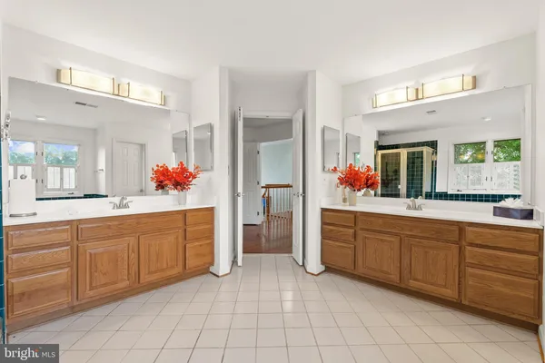 a bedroom with a large bed and a large window