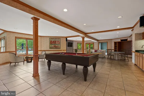 a kitchen with stainless steel appliances granite countertop a refrigerator and a stove