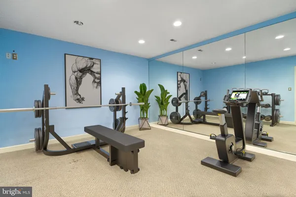 a bathroom with a sink mirror vanity and toilet