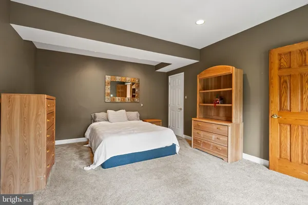 a utility room with cabinets washer and dryer