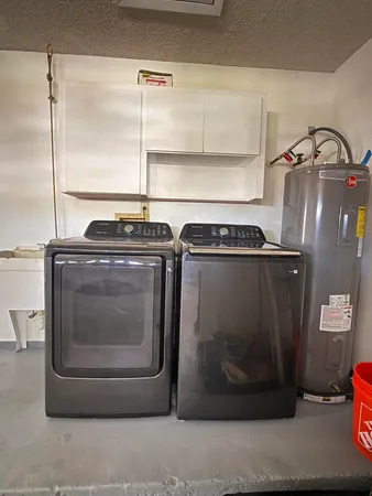 a utility room with washer and dryer