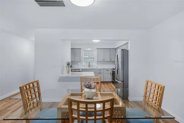 a bedroom with a bed a chair and a window