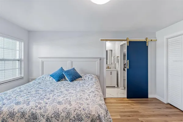 a bathroom with cabinets sink and mirror