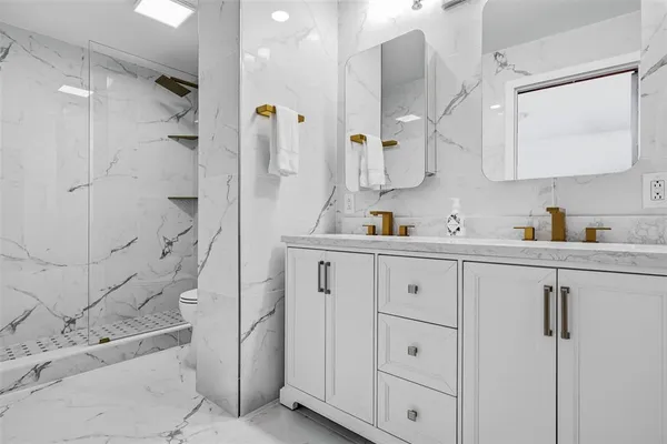 a bathroom with a shower and toilet