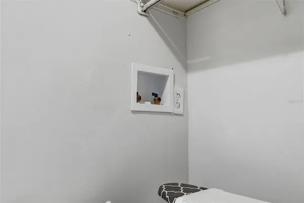 a bedroom with a bed and a table in it