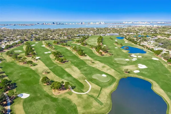 a room with a bench and wooden floor