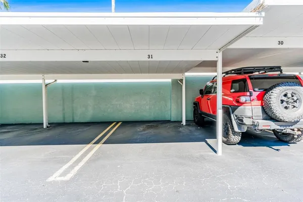a sign board with parking space