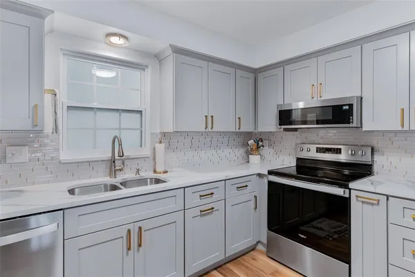 a view of a workspace with furniture and wooden floor