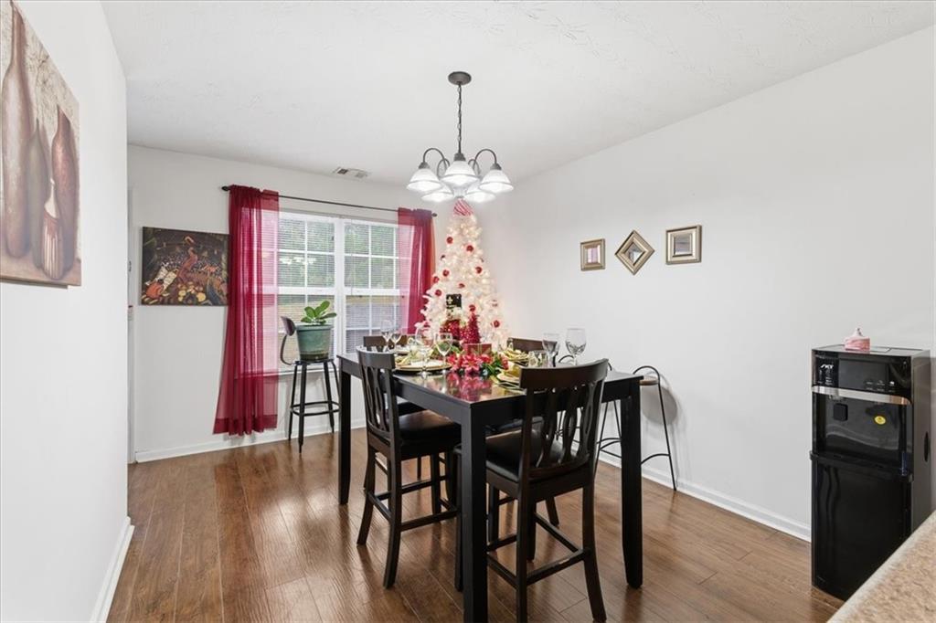 809 Winsap Drive Stockbridge, GA 30281 - Photo 17 of 41 a view of a dining room with furniture window and wooden floor