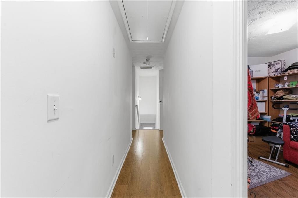 809 Winsap Drive Stockbridge, GA 30281 - Photo 19 of 41 a view of a hallway with wooden floor and a bathroom