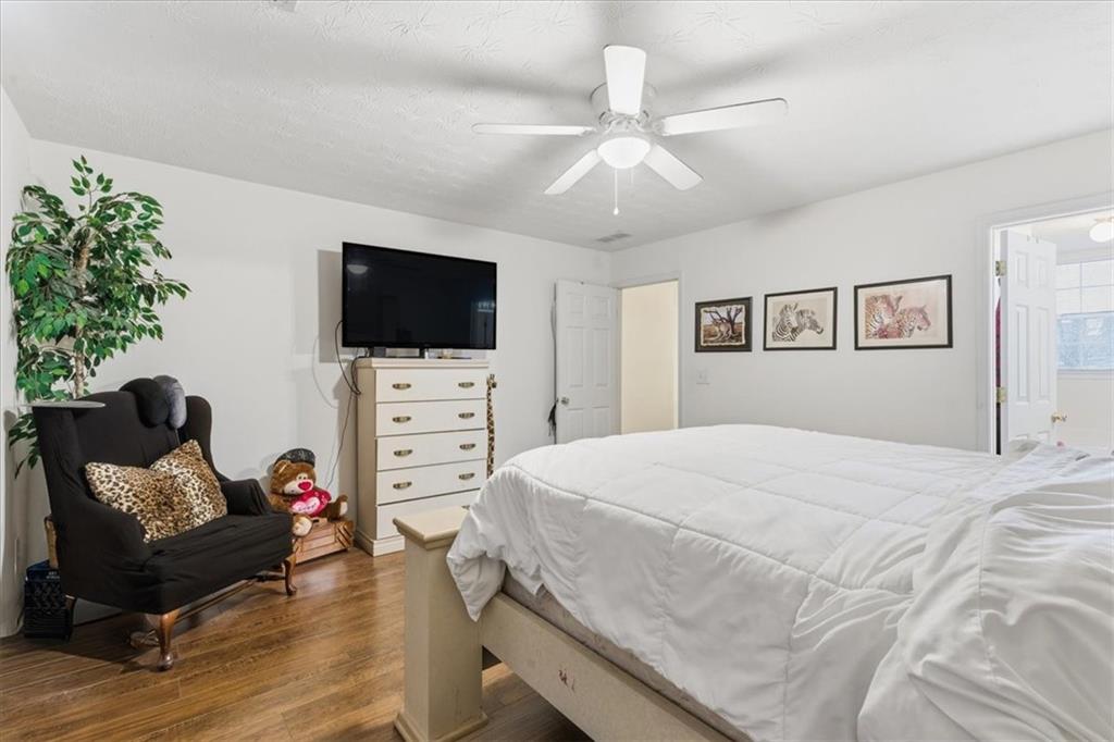 809 Winsap Drive Stockbridge, GA 30281 - Photo 21 of 41 a spacious bedroom with a bed and a flat screen tv