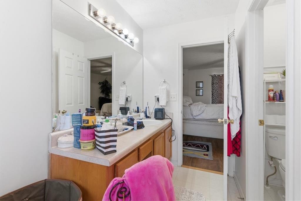 809 Winsap Drive Stockbridge, GA 30281 - Photo 23 of 41 a bathroom with a sink vanity and mirror