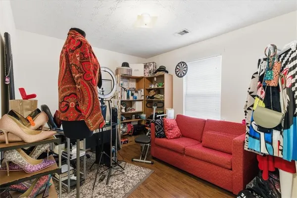 a living room with furniture a rug and a chandelier