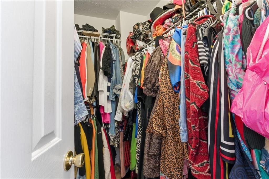 809 Winsap Drive Stockbridge, GA 30281 - Photo 31 of 41 a view of walk in closet with clothes