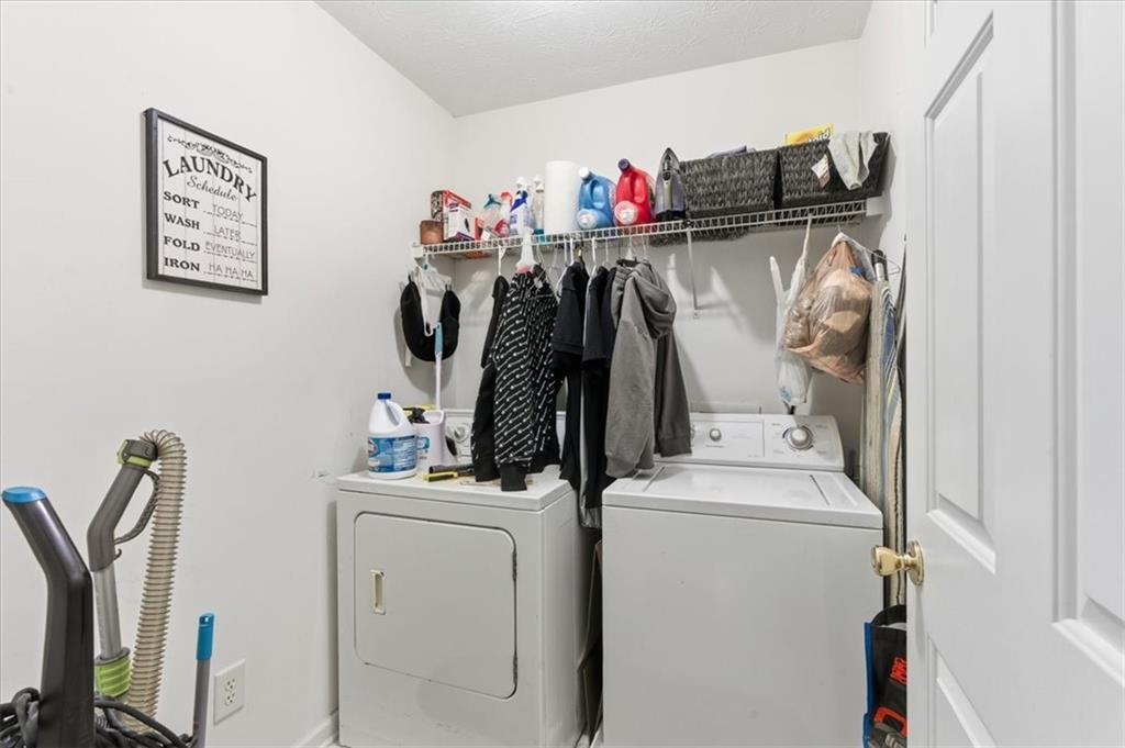 809 Winsap Drive Stockbridge, GA 30281 - Photo 32 of 41 a view of walk in closet with clothes and shoes