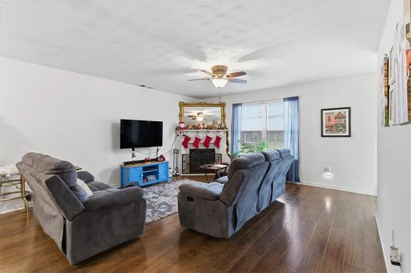 a living room with furniture and a flat screen tv