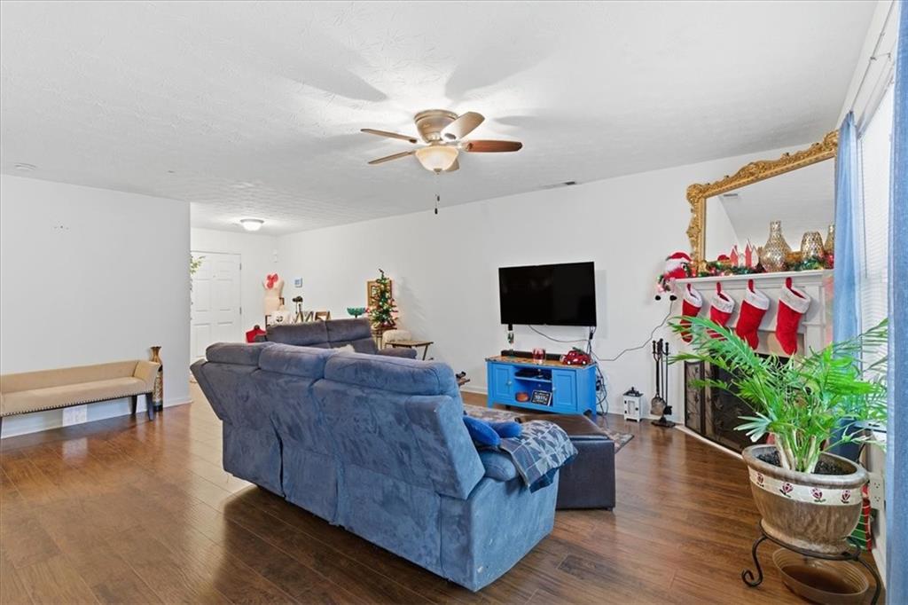 809 Winsap Drive Stockbridge, GA 30281 - Photo 9 of 41 a living room with furniture and a flat screen tv