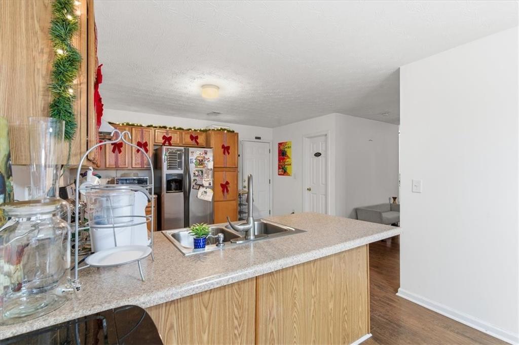 809 Winsap Drive Stockbridge, GA 30281 - Photo 10 of 41 a view of a living room with a sink and cabinets