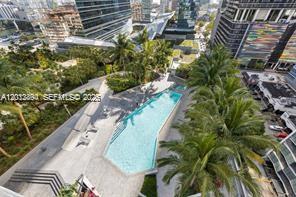 88 Southwest 7th Street, Unit 2210 Miami, FL 33130 - Photo 20 of 24 Resort-style pool deck with city views and lounge areas.