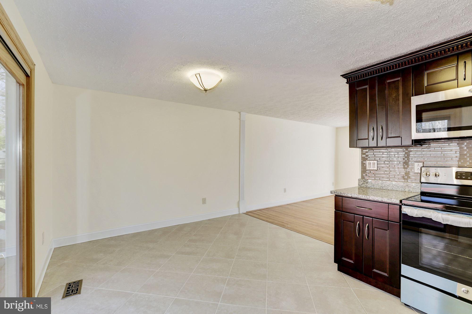 8284 Raindrop Way Springfield, VA 22153 - Photo 12 of 30 View from the Kitchen to the Dining Room