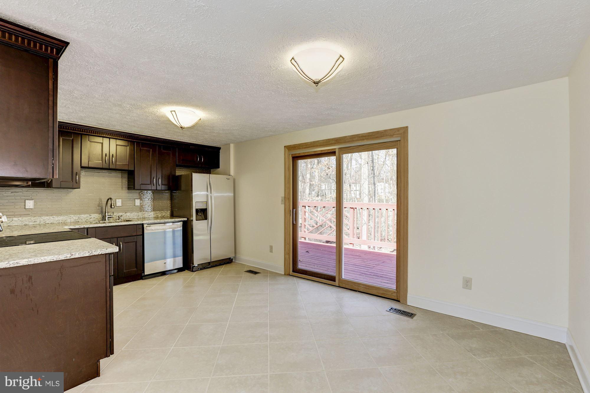 8284 Raindrop Way Springfield, VA 22153 - Photo 9 of 30 Kitchen with the area of the Dining Room