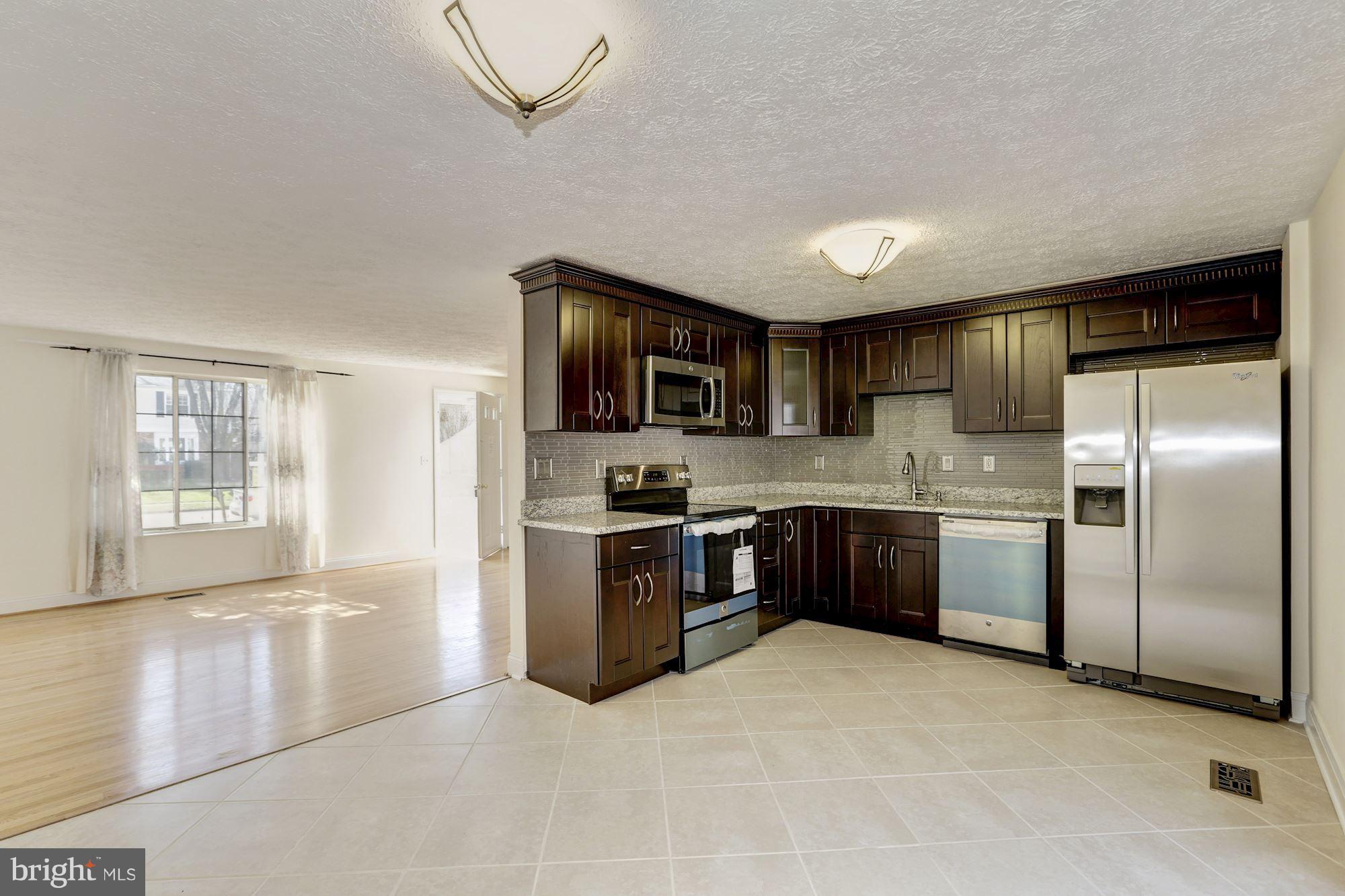 8284 Raindrop Way Springfield, VA 22153 - Photo 10 of 30 A view from the Kitchen/Dinning Room to the LR