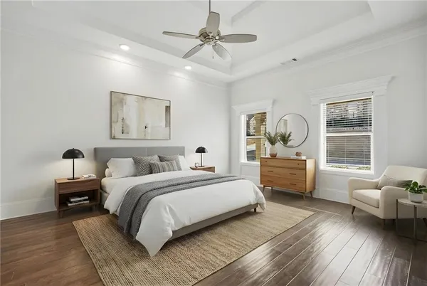 a bedroom with a bed couch and window