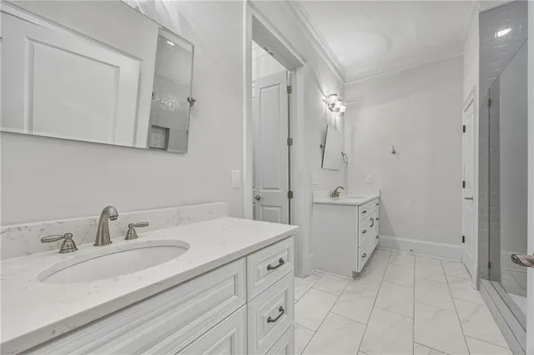 a spacious bathroom with a double vanity sink mirror and