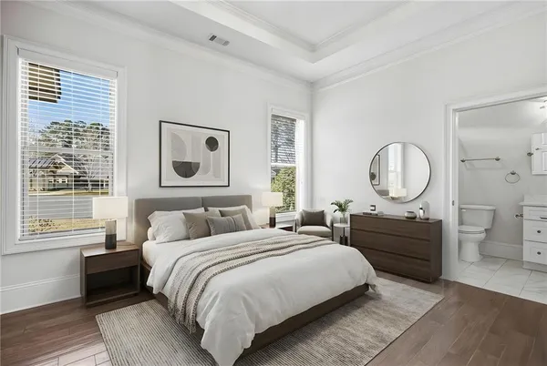 a bedroom with a large bed and a window