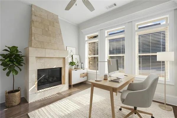 a living room with furniture a window and a fireplace